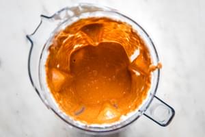 spicy roasted red pepper sauce in a blender made with roasted red peppers, tomato paste, spices basil & cream