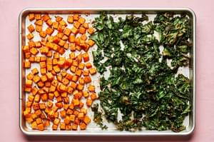 roasted sweet potatoes seasoned with paprika, chili powder, garlic powder, sugar & salt and kale on a baking sheet