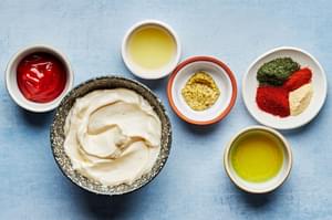 mayo, ketchup, lime juice, pickle juice, garlic powder, dill, paprika, cayenne & ground mustard in bowls for burger sauce