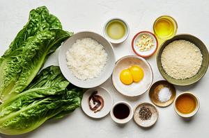 ingredients for caesar salad with homemade caesar dressing in bowls on the counter