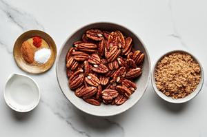 bowls of pecans, brown sugar, cinnamon, salt, cayenne pepper and water to make homemade candied pecans