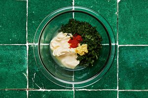 mayo, basil, lemon juice, garlic and paprika in a glass bowl to make basil mayo for chicken burgers