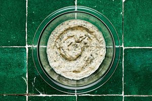 basil mayo in a glass bowl made with mayo, basil, lemon juice, garlic and paprika for chicken burgers