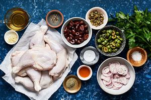 chicken quarters, salt, shallots, olive oil, olives, capers, parsley, garlic, Italian seasoning & red wine vinegar in bowls