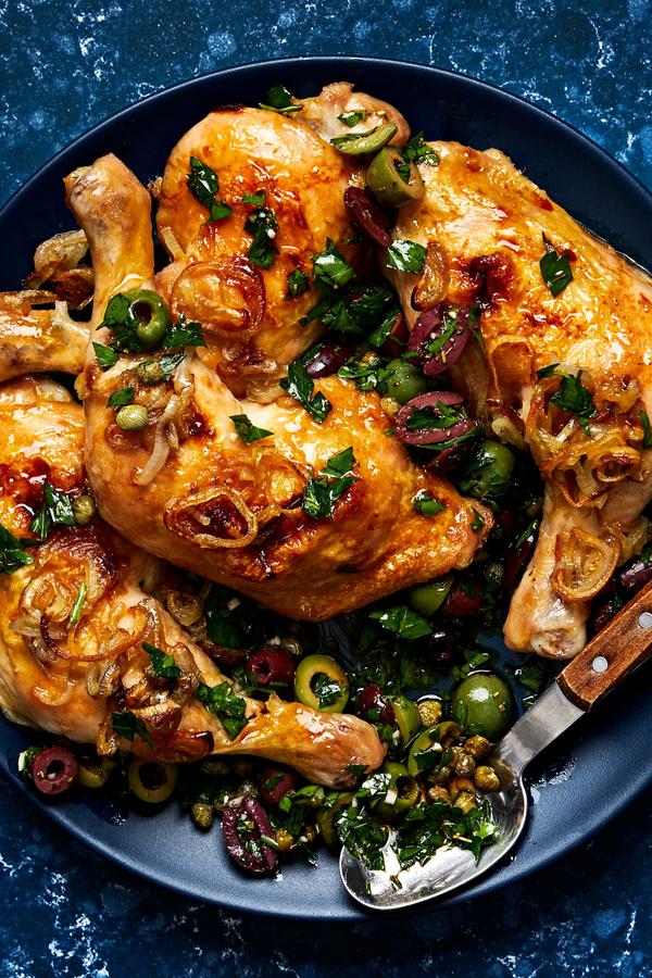 Chicken Quarters with Shallots and Olive Salad with capers, parsley, garlic & Italian seasoning on a serving platter
