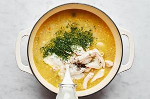a stock pot full of onion, carrots, celery, garlic, olive oil, butter flour, stock, milk, salt, pepper, dill and chicken