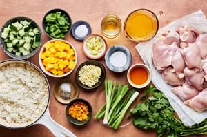ingredients for Citrus Chicken Rice Bowl with Ginger Jalapeno Sauce in bowls on the counter