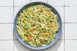 homemade classic coleslaw in a serving bowl on the counter