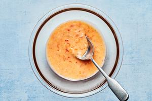homemade ginger mayo made with mayo, sweet chili sauce and grated ginger in a bowl with a spoon