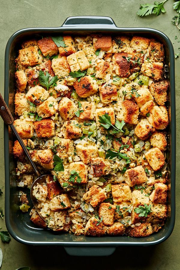cornbread stuffing in a casserole dish made with butter, onion, celery, spices parsley, vegetable stock and eggs