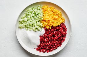 cranberries, apples and oranges that have been pulled in a food processor in a bowl with sugar, salt and lemon juice