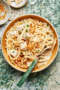 creamy turkey pasta in a bowl made with butter, spices, cream and parmesan