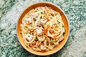 creamy turkey pasta in a bowl made with butter, spices, cream and parmesan