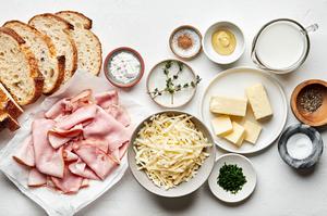 bread, ham, Gruyère, butter, flour, milk, dijon and spices in bowls to make croque monsieur