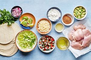 chicken, taco seasoning, olive oil, lime juice, tortillas, lettuce, cheese and pico in bowls to make easy chicken tacos