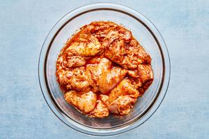 chicken thighs marinating in taco seasoning, olive oil and lime juice to make for easy chicken tacos