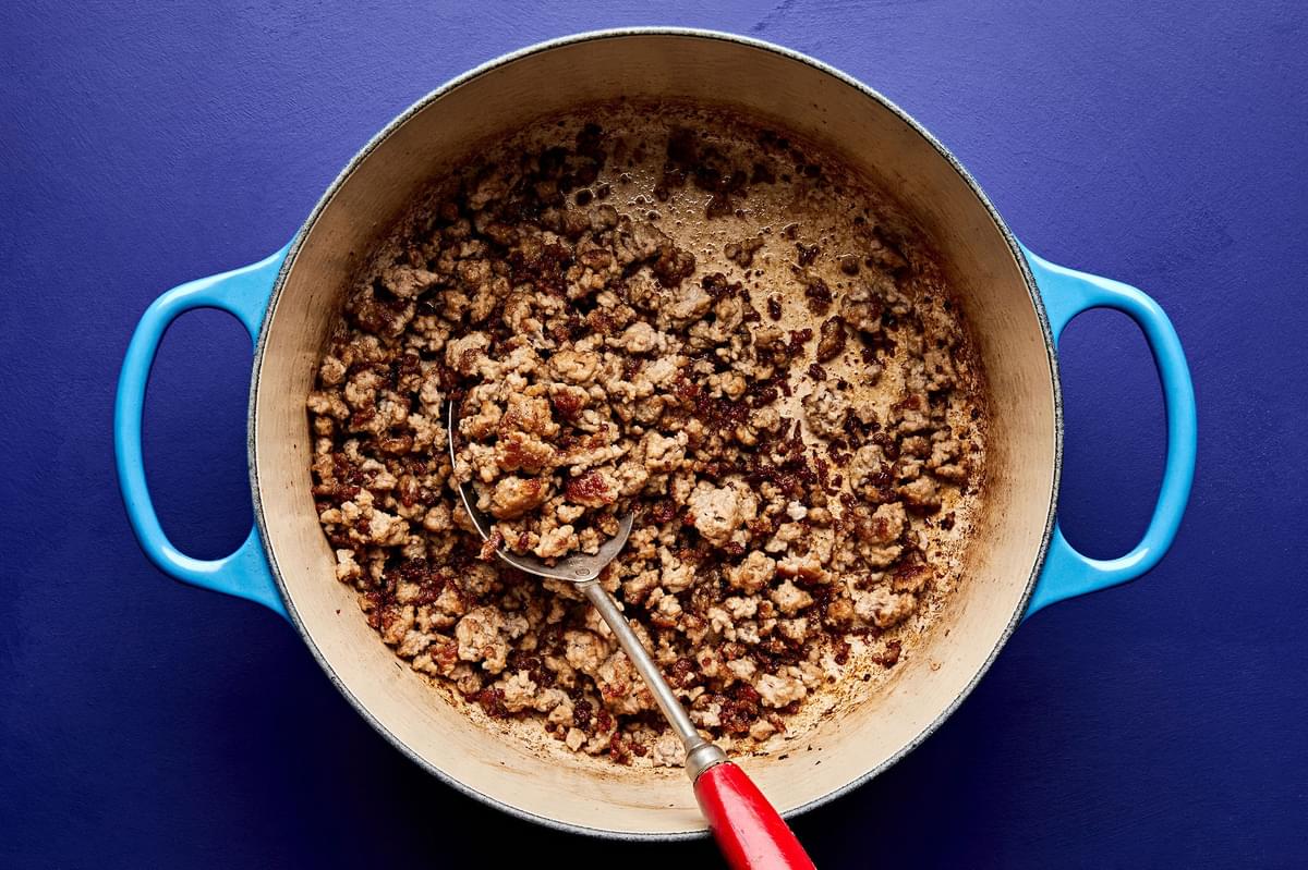 ground pork being cooked in a pot