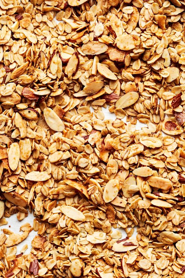 Easy Homemade Granola made with oats, almonds, salt, brown sugar, syrup, oil and vanilla extract