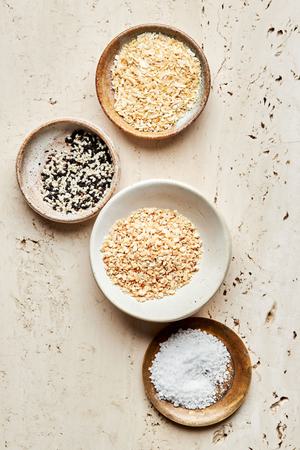 dried minced garlic, dried minced onion, sesame seeds and salt in bowls to make Homemade everything bagel seasoning