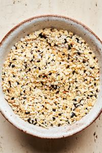 Homemade everything bagel seasoning in a bowl made with dried minced garlic, dried minced onion, sesame seeds and salt