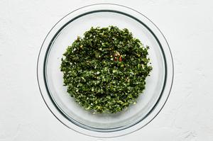 homemade gremolata in a glass bowl made with parsley, mint, garlic, olive oil, salt, lemon zest & juice & crushed red pepper