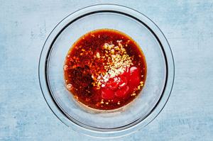sesame oil, ginger, garlic, soy sauce, rice vinegar, brown sugar, ketchup and smoked paprika in a glass bowl