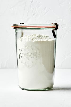 homemade pancake mix stored in an airtight jar made with flour, sugar, baking powder, baking soda and salt