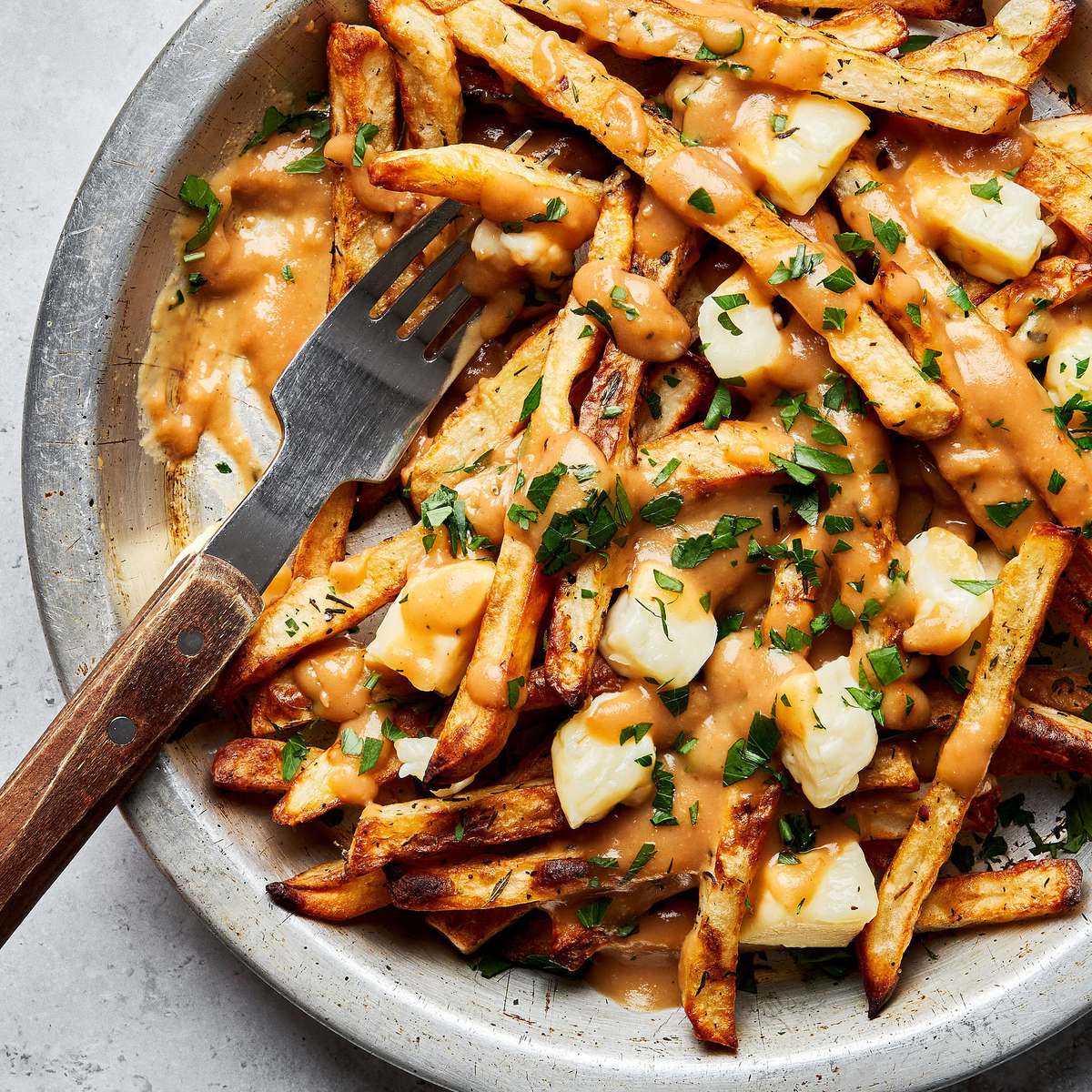 Poutine: The Ultimate Comfort Food You Need to Try – Discover it with The Monroe Hotels