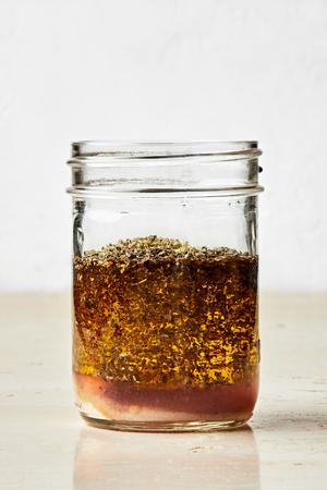 garlic powder, oregano, dried basil, salt, olive oil, and red wine vinegar in a jar to make homemade Italian dressing