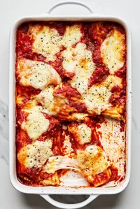 homemade manicotti in a 9x13 baking dish