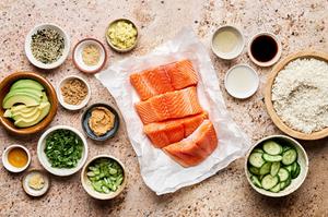 salmon, spices, soy sauce, rice vinegar, rice, avocado and cucumber in prep bowls to make miso salmon rice bowls