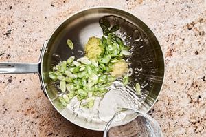 grated ginger, green onions, water, garlic, and avocado oil in a pot