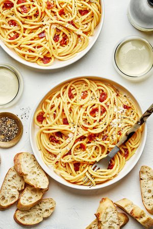 Creamy pasta carbonara topped Parmesan, pepper and flaky salt served with bread