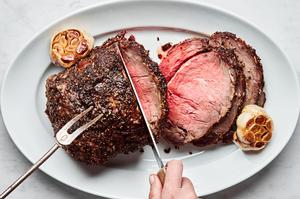homemade prime rib seasoned with salt, pepper, garlic powder, mustard powder, thyme, au jus seasoning, garlic and olive oil