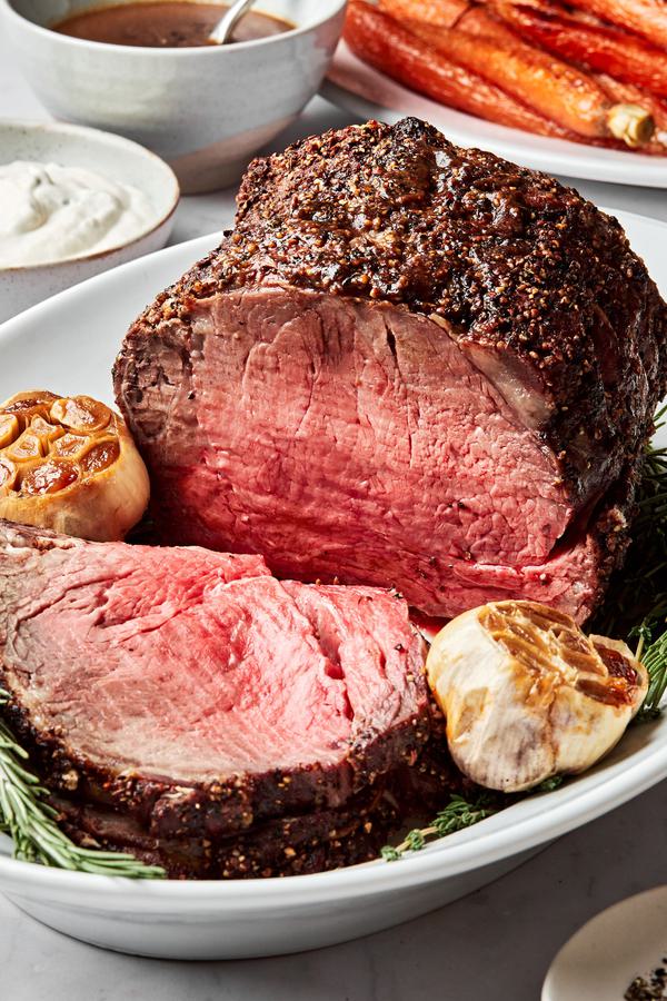 homemade prime rib seasoned with salt, pepper, garlic powder, mustard powder, thyme, au jus seasoning, garlic and olive oil