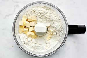 flour and cold cubed butter in a food processor to make the dough for homemade red lobster cheddar bay biscuits