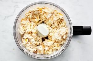 homemade red lobster cheddar bay biscuit dough in a food processor made with flour, butter, spices, cheese and milk