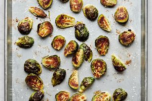 roasted Brussels sprouts on a baking sheet just out of the oven with caramelized, crunchy outsides and soft interiors