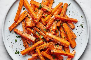 a plate of perfectly roasted carrots with caramelized edges, the perfect fall and winter side side