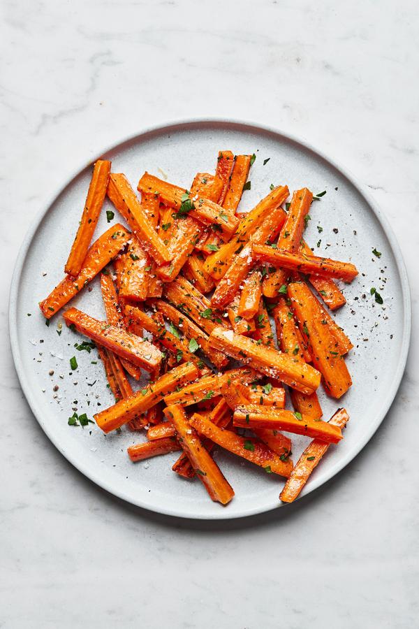 a plate of perfectly roasted carrots with caramelized edges, the perfect fall and winter side side