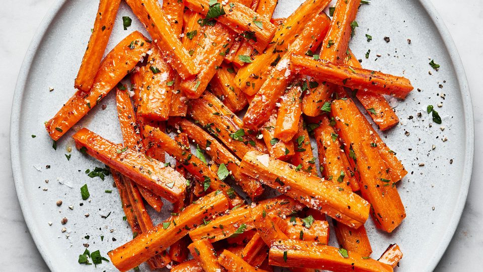 a plate of perfectly roasted carrots with caramelized edges, the perfect fall and winter side side