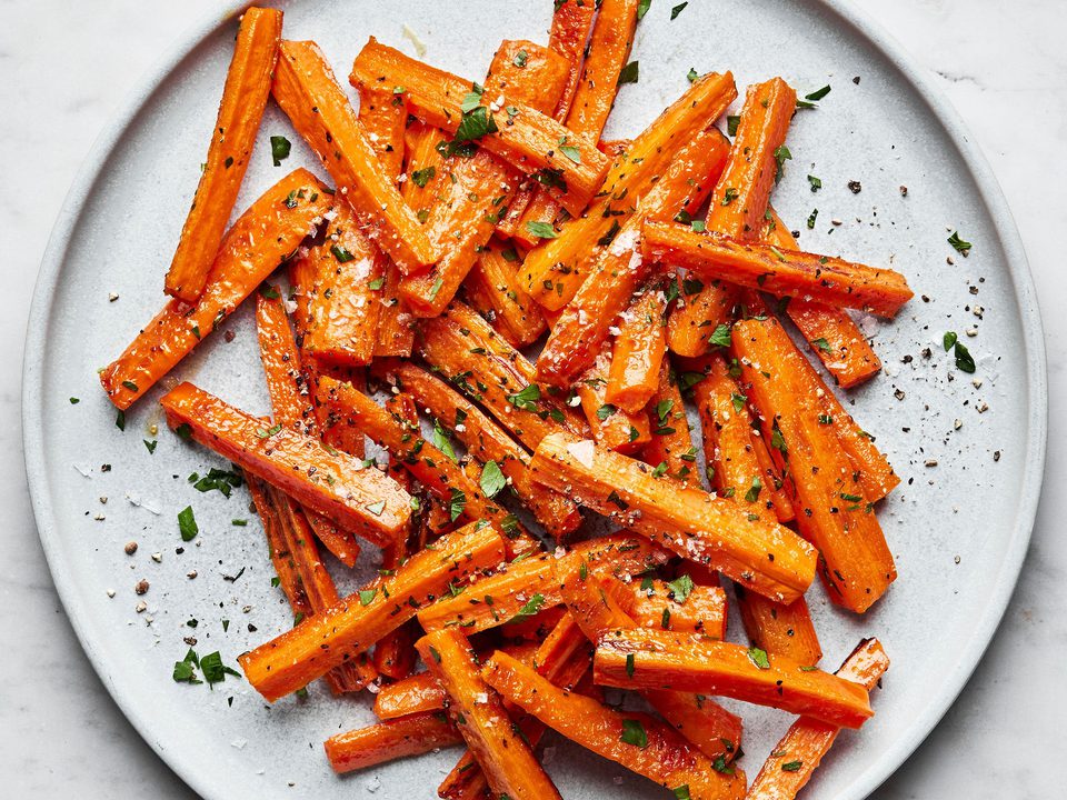 a plate of perfectly roasted carrots with caramelized edges, the perfect fall and winter side side