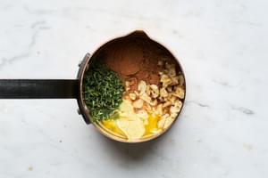water, roasted garlic, honey, orange juice, mustard, thyme, cinnamon, and salt in a small sauce pan to make a glaze for ham