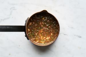 water, roasted garlic, honey, orange juice, mustard, thyme, cinnamon, and salt in a small sauce pan to make a glaze for ham