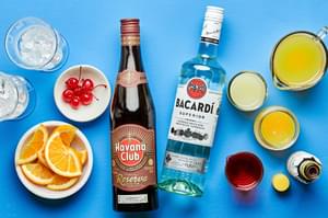Ice, Dark rum, light rum, oranges, maraschino cherries, orange juice, bitters and pineapple juice.