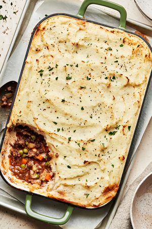 Shepherd’s pie in a casserole, topped with golden mashed potatoes and baked until lightly browned, topped with pepper & thyme