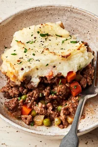 Shepherd’s pie in a bowl, topped with golden mashed potatoes and baked until lightly browned