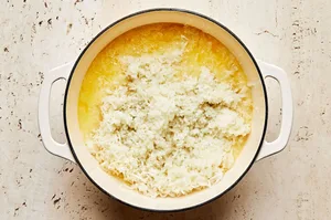 boiled potatoes that have gone through a potato ricer and added to a pot with butter and milk