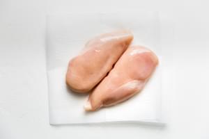 2 raw chicken breasts ready to be cooked to make shredded chicken