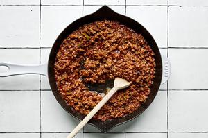sloppy joe beef in a skillet made with jalapeno, bell pepper, garlic, onion, ketchup, worcestershire, mustard & spices